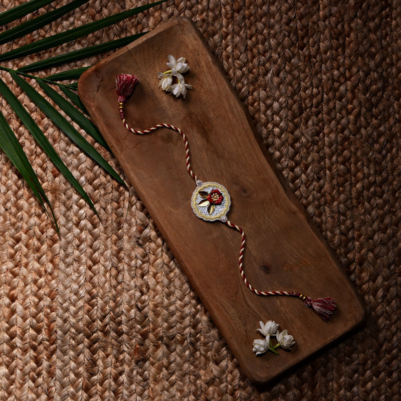 Metal Flower Rakhi With Peach lemon Work