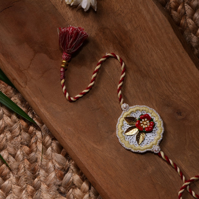 Metal Flower Rakhi With Peach lemon Work
